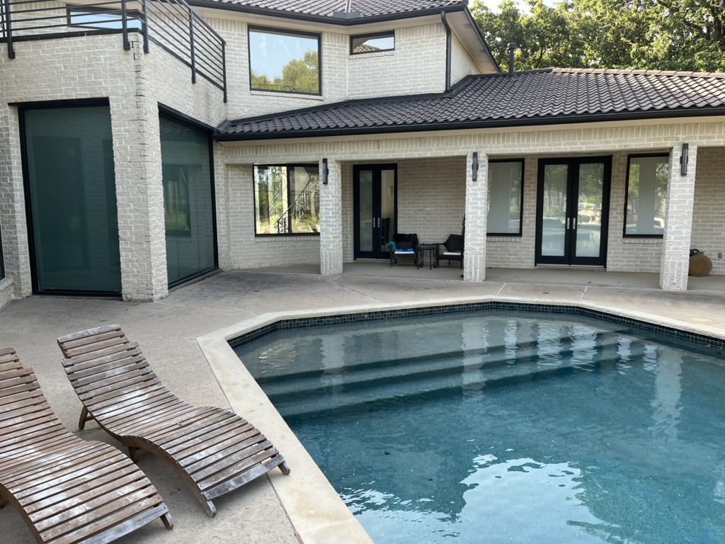 Spotless windows on a brick estate overlooking the pool