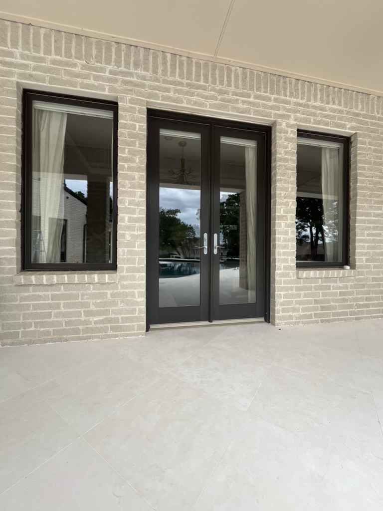 Crystal-clear French doors and windows after cleaning